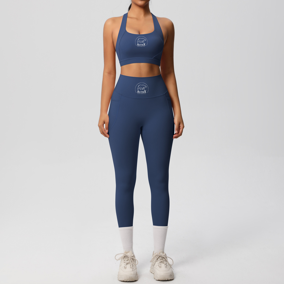AltaiX Women's Performance Sports Bra & Pocket Leggings Set in Summit Blue with a supportive body-contouring fit, high-waisted pocket leggings, medium-support sports bra and breathable four-way stretch fabric for gym training, HYROX, running, Pilates and everyday wear.