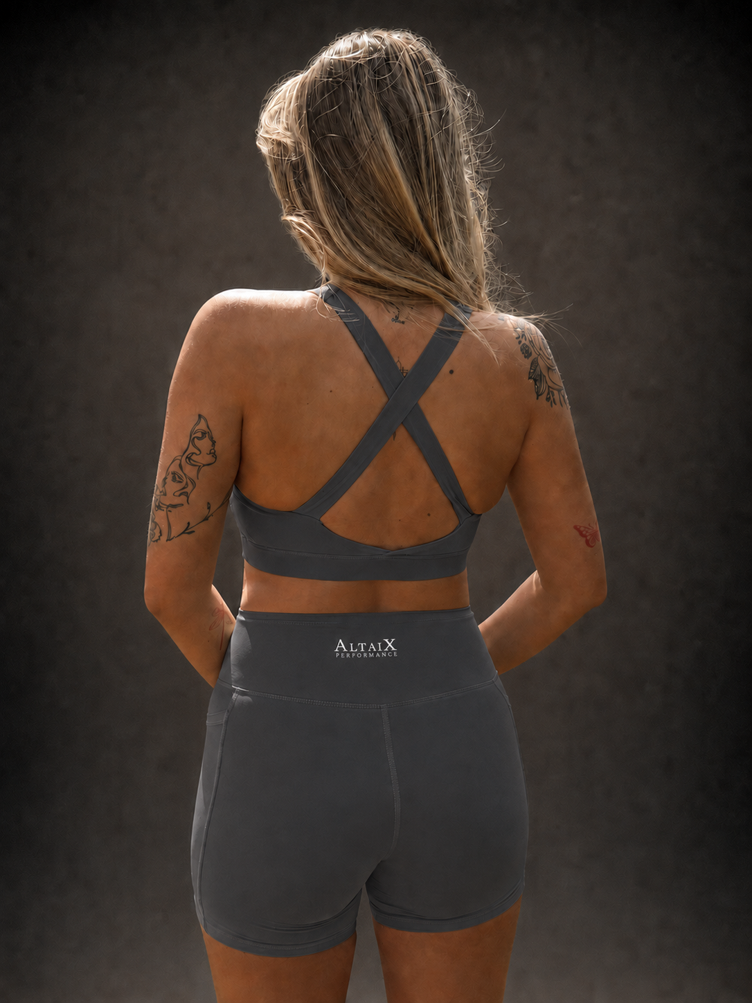 AltaiX Women's Performance Sports Bra & Shorts Set in Slate Grey with a supportive body-contouring fit, high-waisted shorts with side pockets and breathable four-way stretch fabric for gym training, HYROX, running and everyday wear.