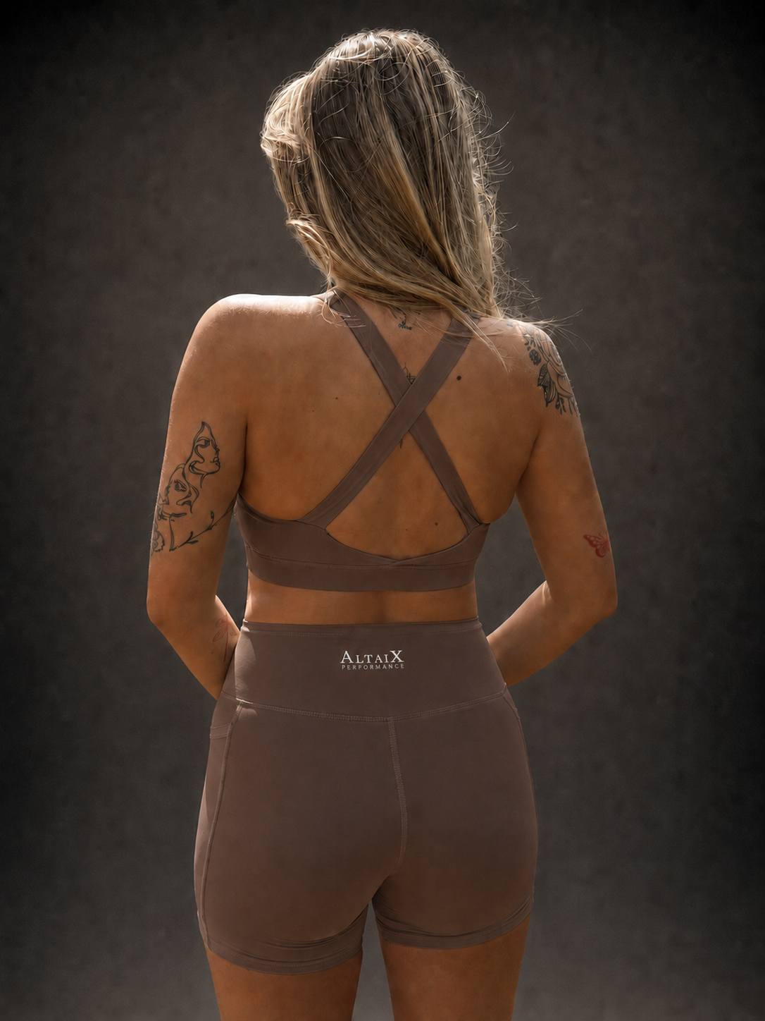 AltaiX Women's Performance Sports Bra & Shorts Set in Terra Brown with a supportive body-contouring fit, high-waisted shorts with side pockets and breathable four-way stretch fabric for gym training, HYROX, running and everyday wear.