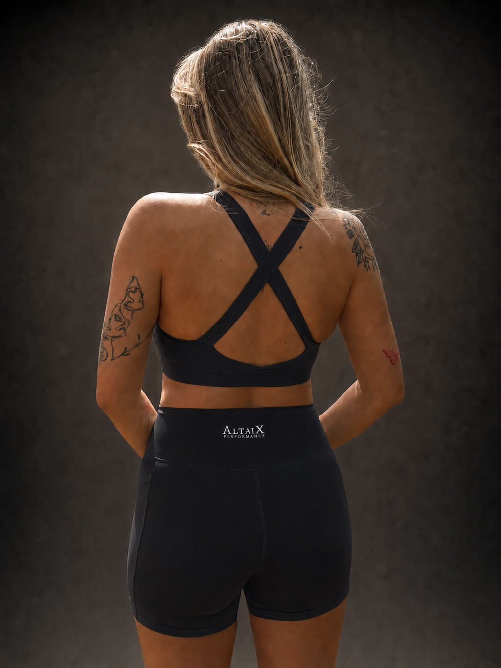 AltaiX Women's Performance Sports Bra & Shorts Set in Midnight Black with a supportive body-contouring fit, high-waisted shorts with side pockets and breathable four-way stretch fabric for gym training, HYROX, running and everyday wear.