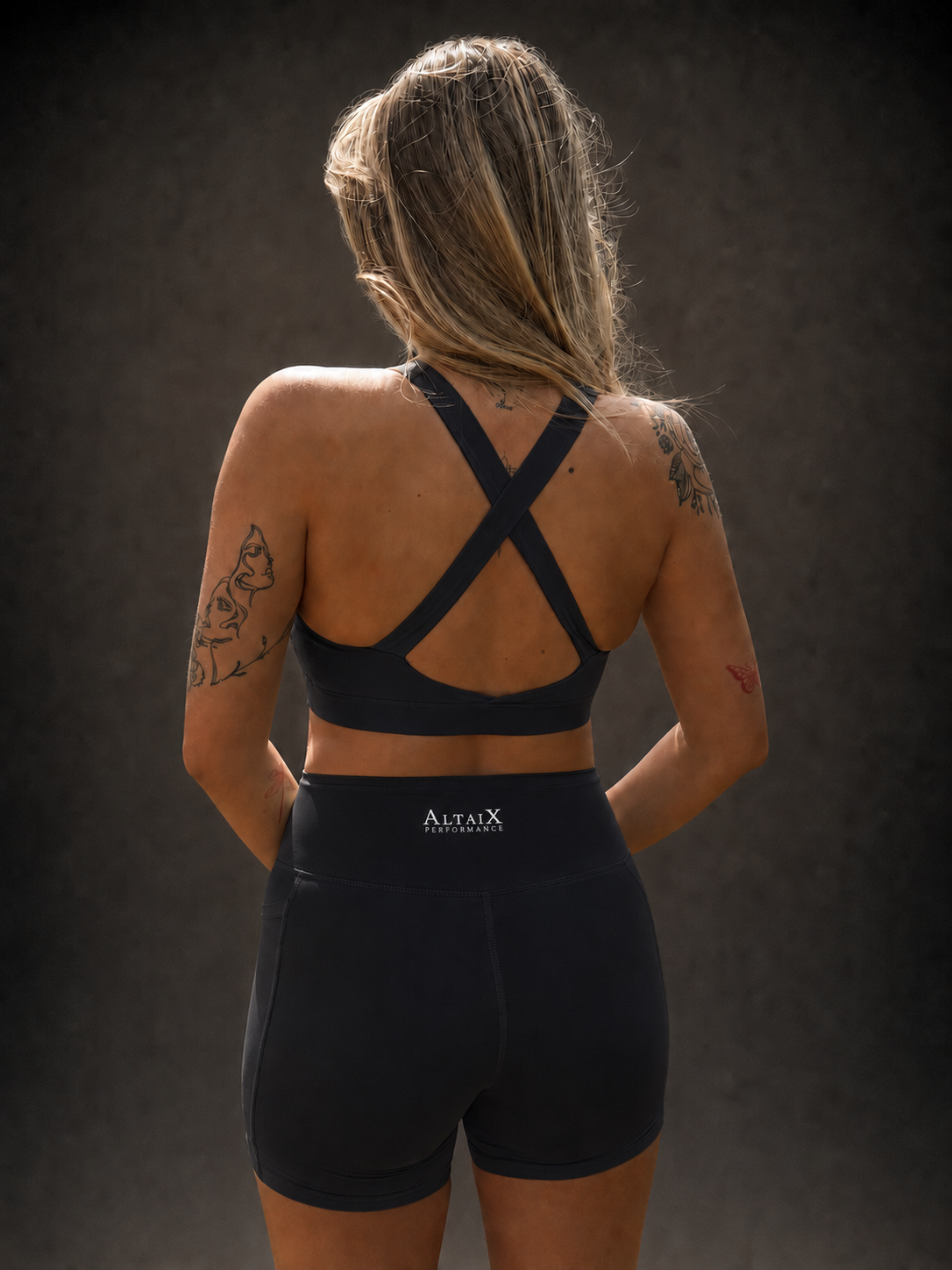 AltaiX Women's Performance Sports Bra & Shorts Set in Midnight Black with a supportive body-contouring fit, high-waisted shorts with side pockets and breathable four-way stretch fabric for gym training, HYROX, running and everyday wear.