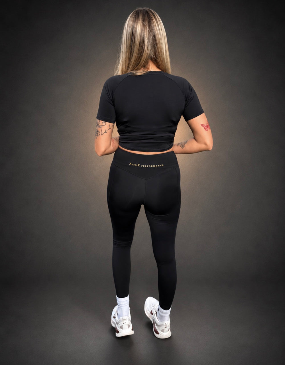 AltaiX First Edition Women's Performance Set featuring a supportive cropped training top and high-waisted sculpting leggings with four-way stretch and signature gold branding for gym training, HYROX, strength training and everyday wear.